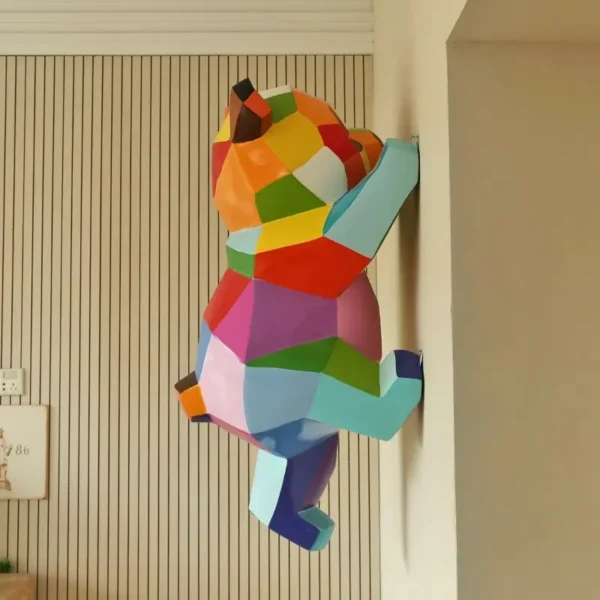 Geometric wall climbing panda sculpture