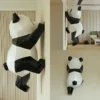 Geometric wall climbing panda sculpture